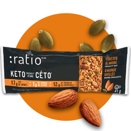 A Ratio Toasted Almond Crunchy Bar surrounded by almond on an orange background