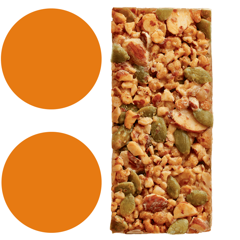 A Ratio : Toasted Almond Crunchy Bar next to 2 bright orange circles stacked on top of each other.