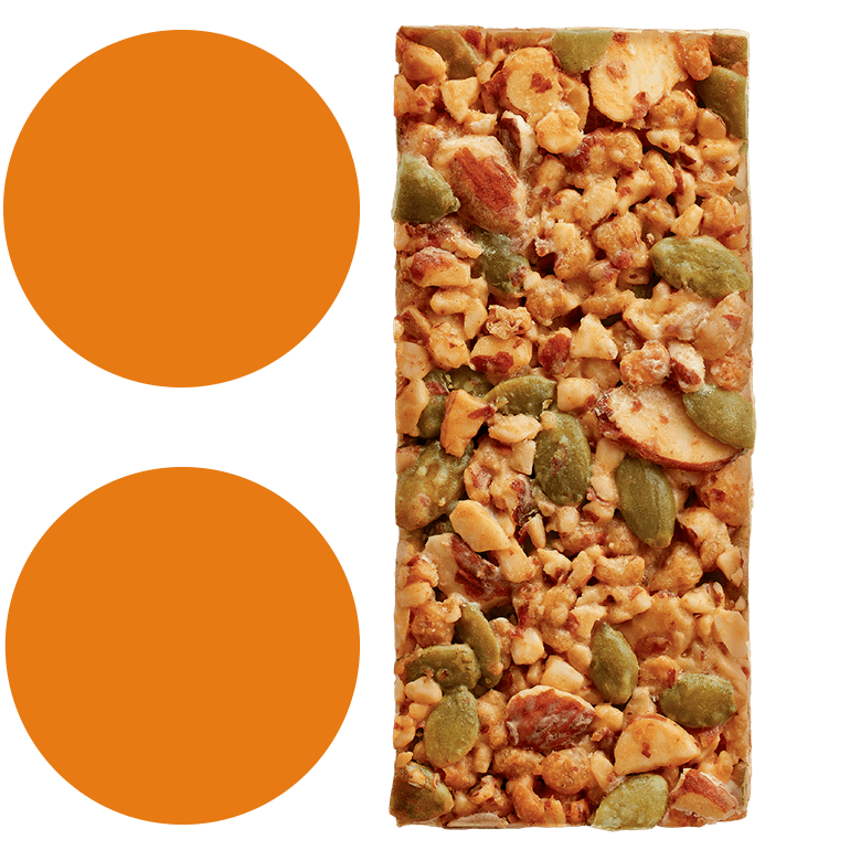 A Ratio Toasted Almond Crunchy Bar next to 2 bright orange circles stacked on top of each other.